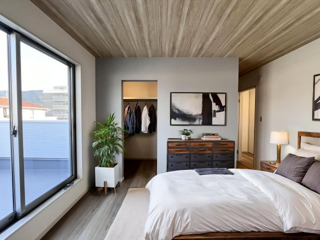 バルコニーと面しているのでスムーズに布団を干せます。この家具はAI生成によって配置されたものです